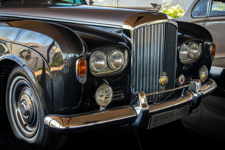 vintage car with chrome finish at a luxury car show