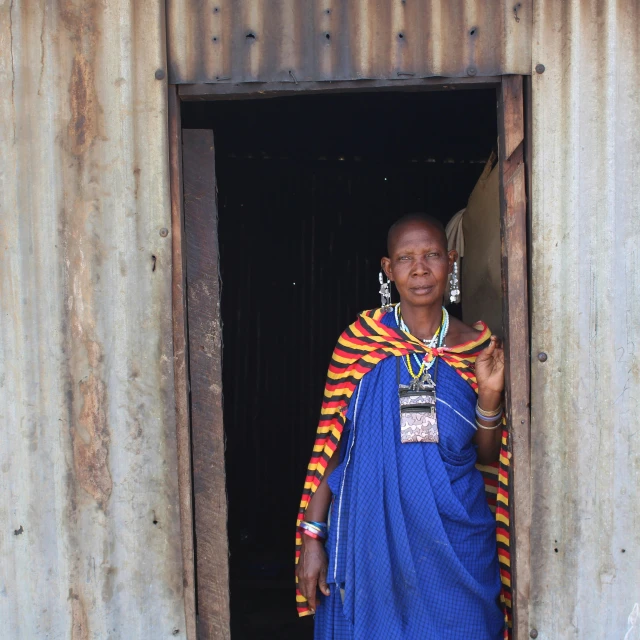 woman standing at doorway of house with jewelry on it