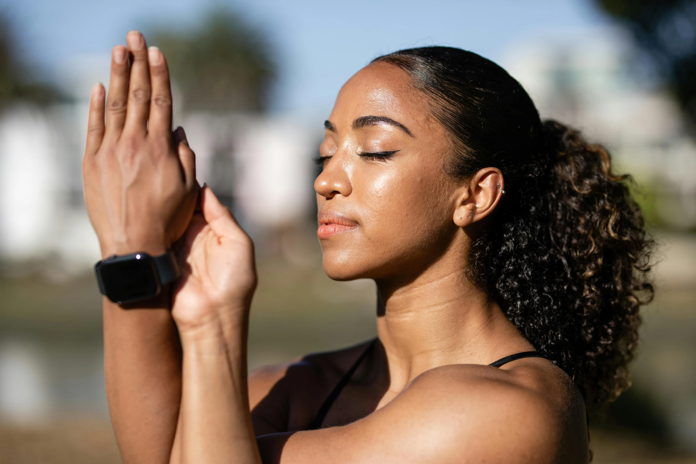 a woman holding her hands together, clapping