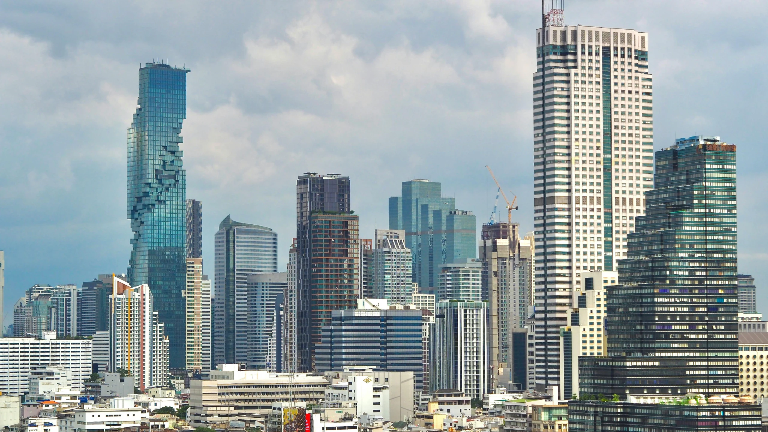 a city skyline shows tall buildings and very high rise