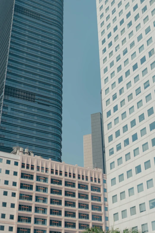 tall buildings sitting side by side with a few windows