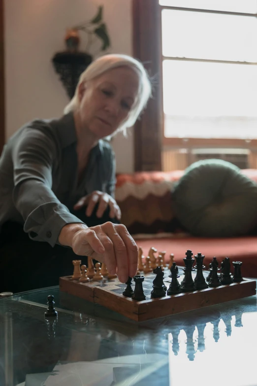 a person playing chess in the living room