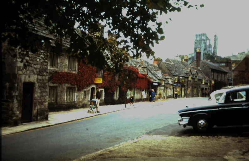 cars and people on bicycles traveling down the street