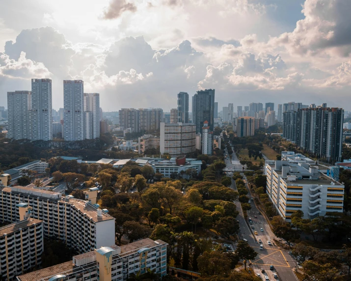 a city with tall buildings and a road next to it