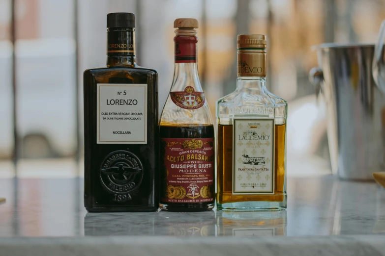 an assortment of alcohol bottles sitting on top of a table