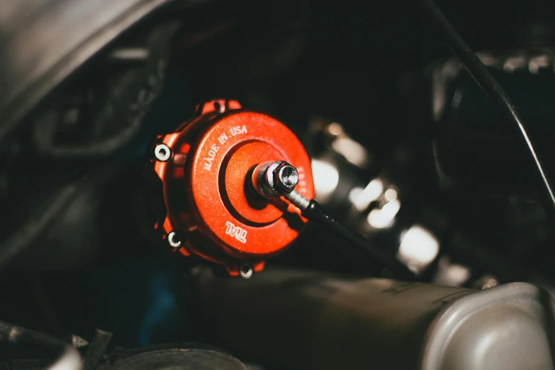 red wheel hub on the dashboard of a car