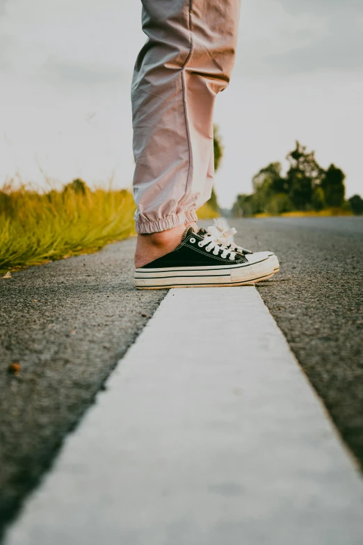 a person is standing on a straight walk