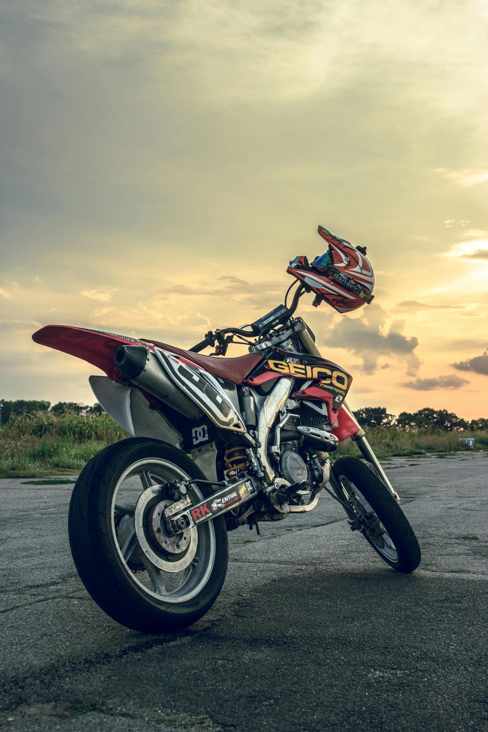 a man sits on the back of a motorcycle