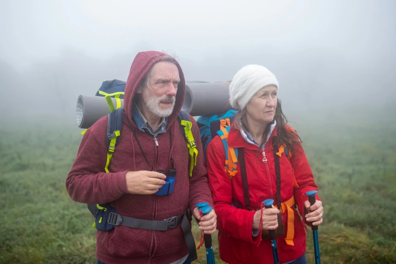 a couple of hikers on a foggy day