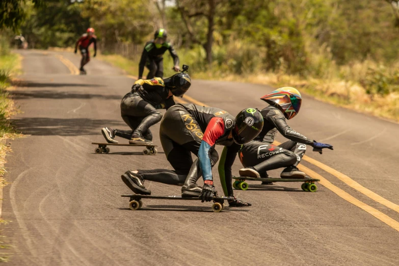 some people are riding down a long stretch of road