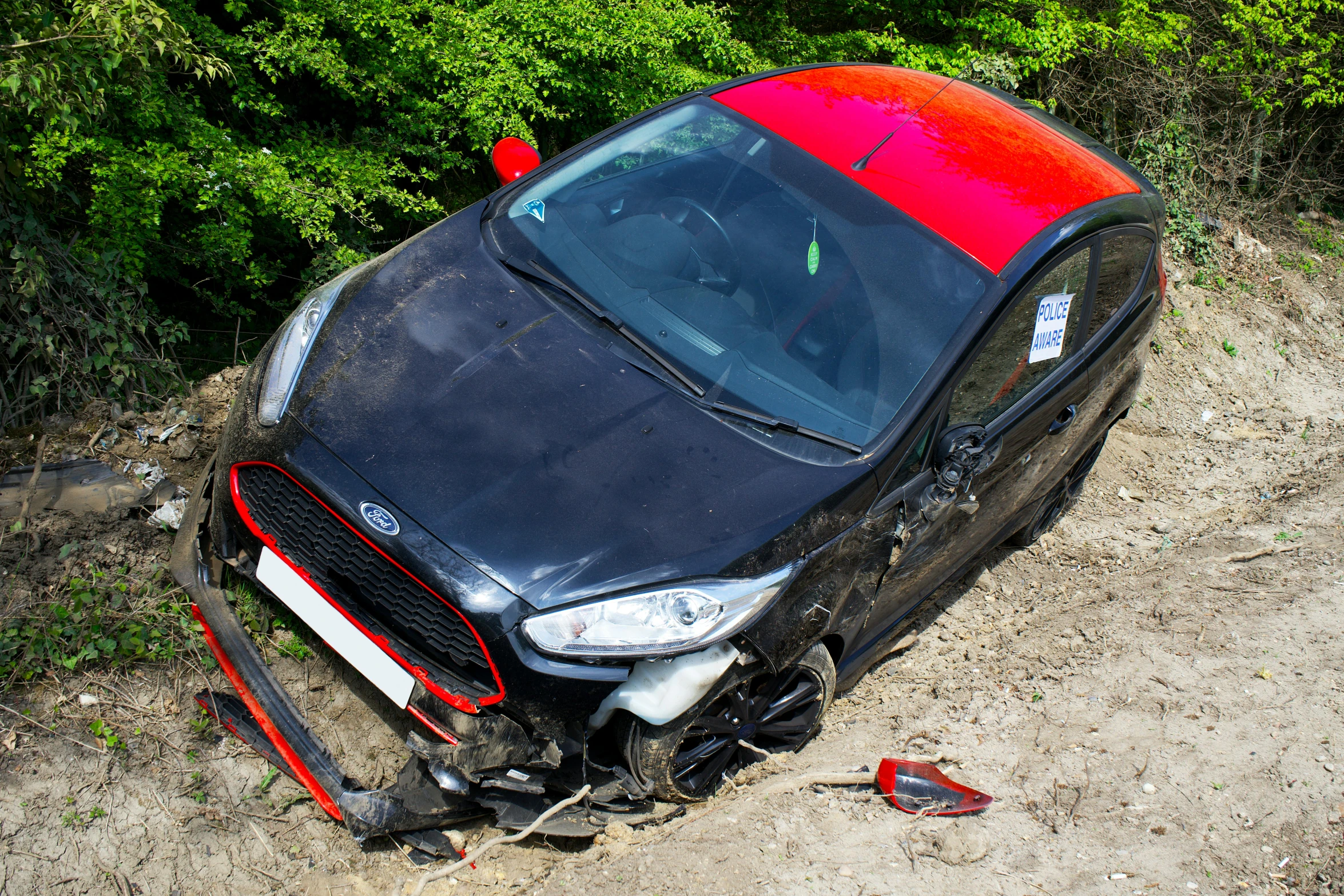 a black car that is on the ground