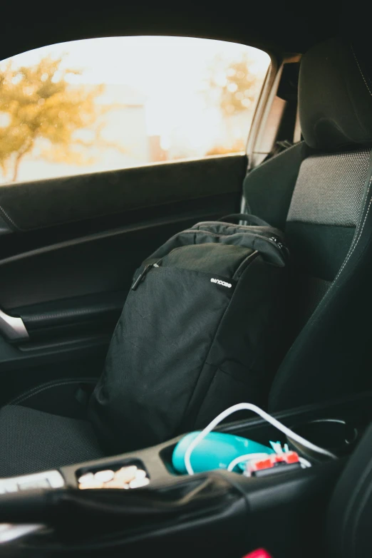 luggage in the back seat of a car next to a window