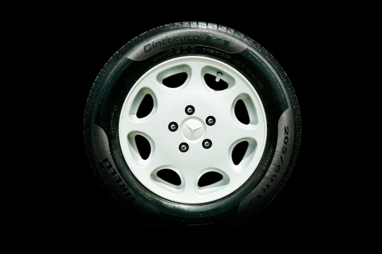 two black and white car wheels with white spokes on them