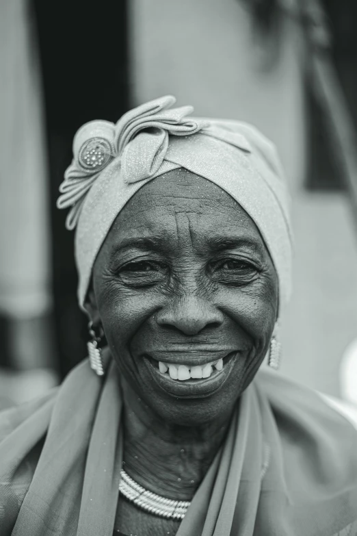 an elderly black and white po of a smiling woman
