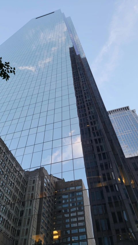 skyscrs in a city at sunset from the ground