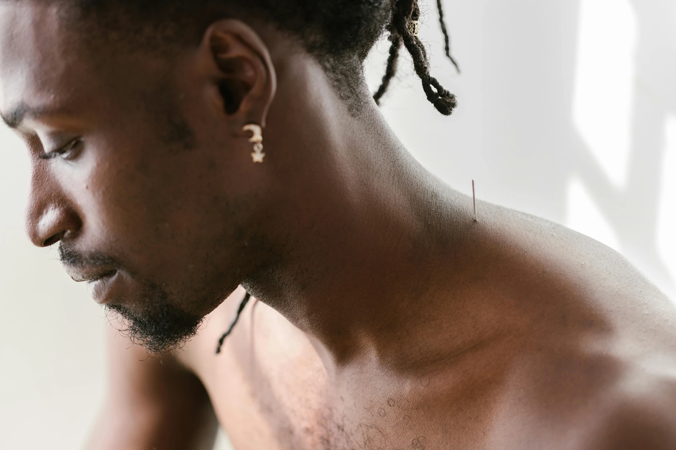 a close up s of a man wearing ear hooks