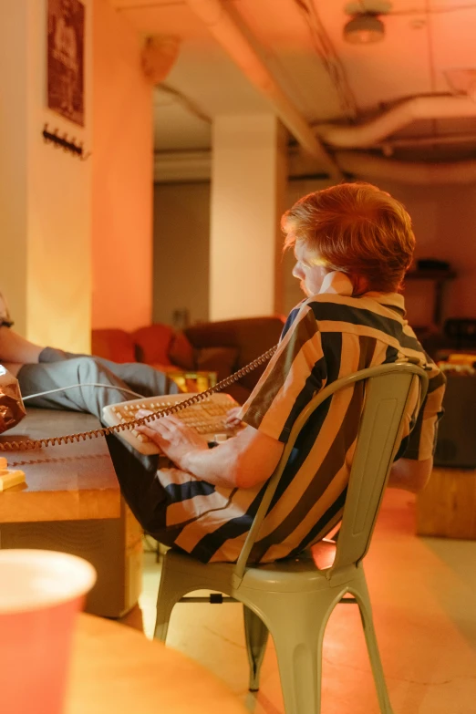 woman talking on the phone while sitting in a chair