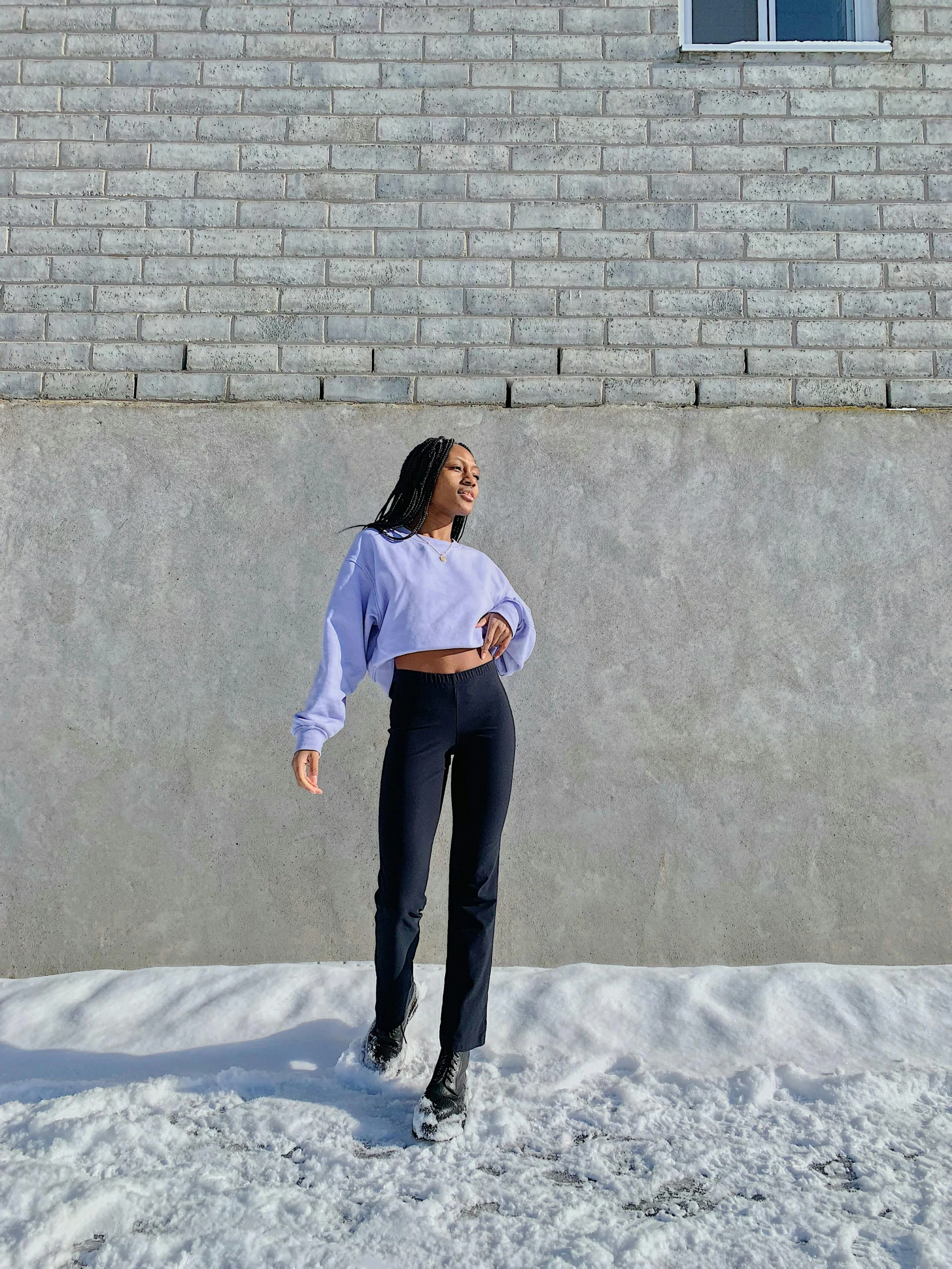 woman standing with her back against the wall