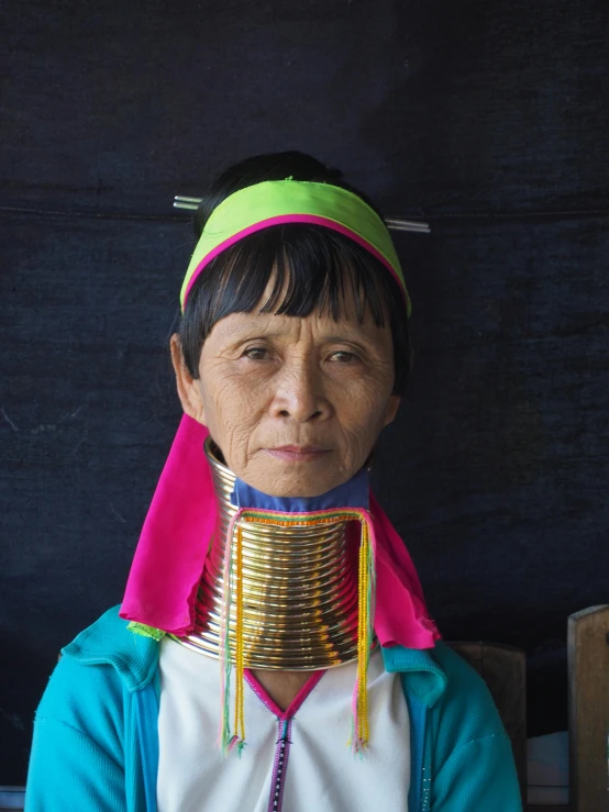 a woman with a neck harness and blind cord on her neck