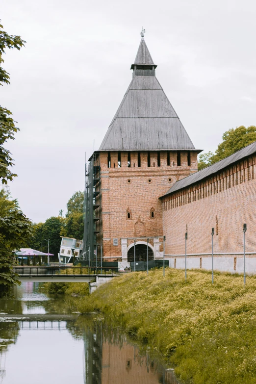 an image of a building with a water pond