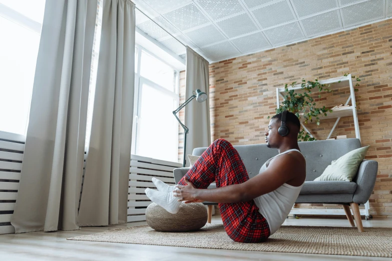 man sitting on the floor, holding bags