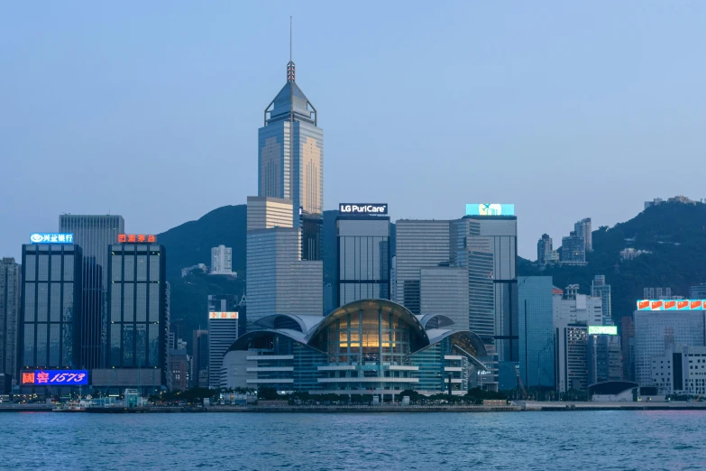 tall buildings line the waterfront in hong