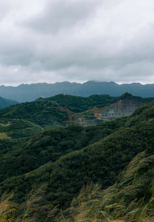 a mountainous valley with mountains in the background