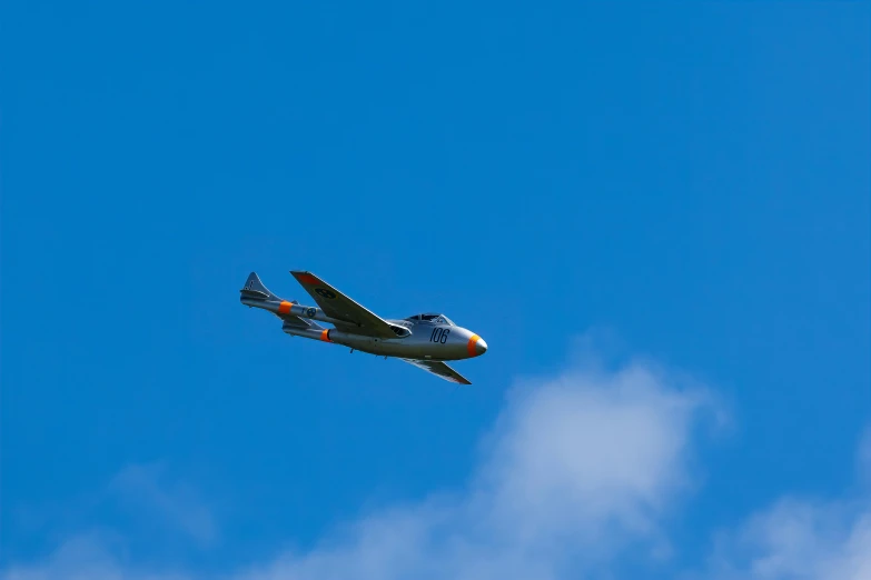 an airplane is flying through the air in an cloud