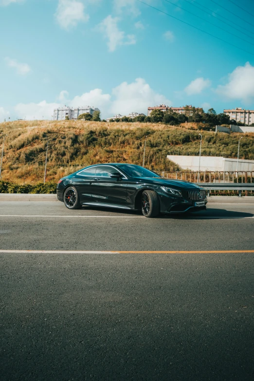 a black car parked in a parking lot