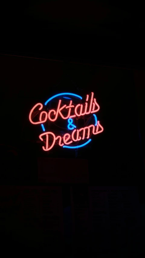neon sign for cocktail and dreams in the dark