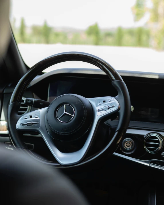 the steering wheel and dash of a car