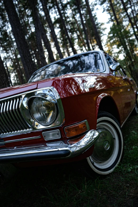 an old car is sitting outside in the grass