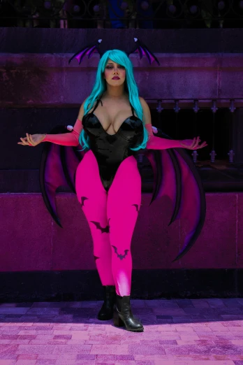 woman with blue hair wearing a black and pink costume