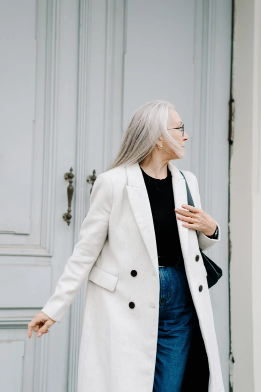 a woman with gray hair is walking