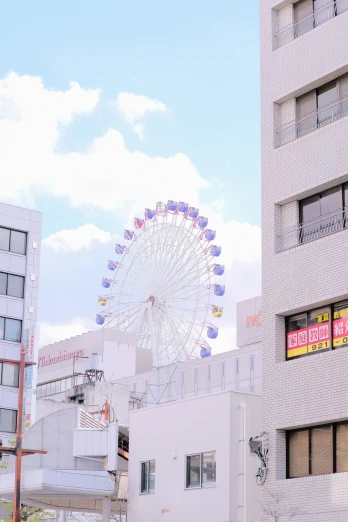 the ferris wheel is brightly visible from the window