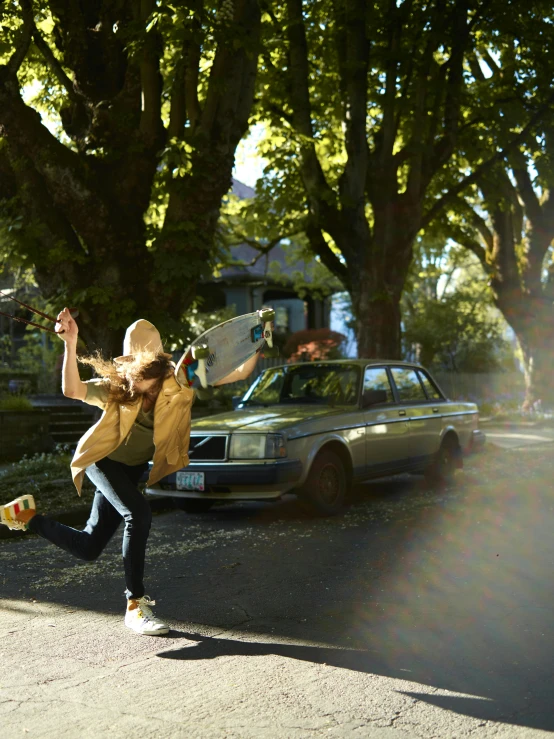 a girl is dancing on the street with her skateboard