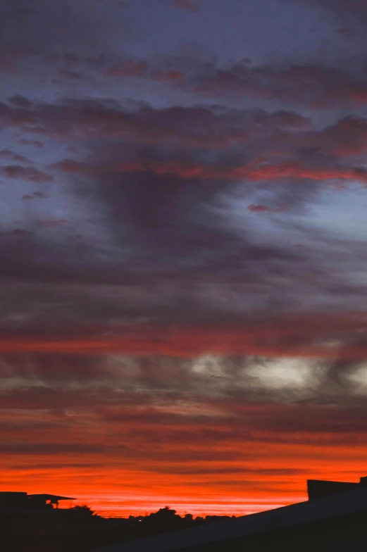 a view from behind the clouds at sunset