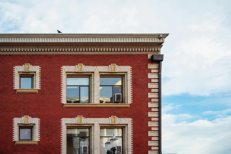 a brick building with lots of windows on top