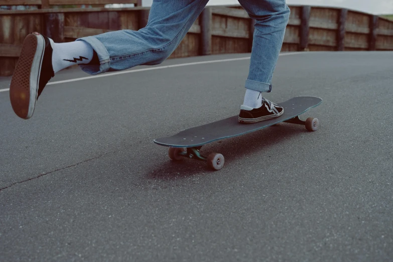 a person standing on their skate board outside