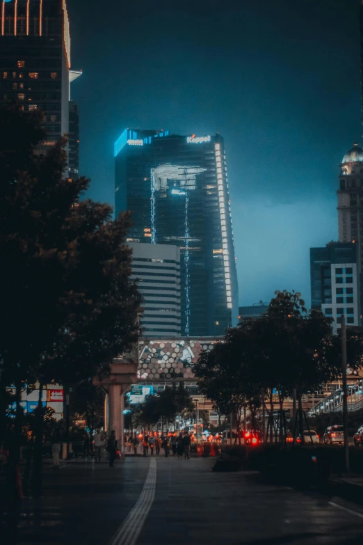 a large city filled with tall buildings next to trees