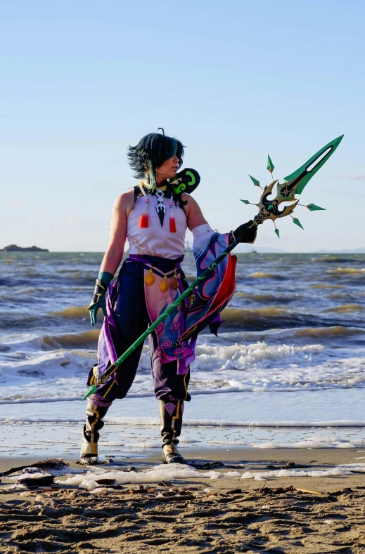 a woman on a beach with a large kite