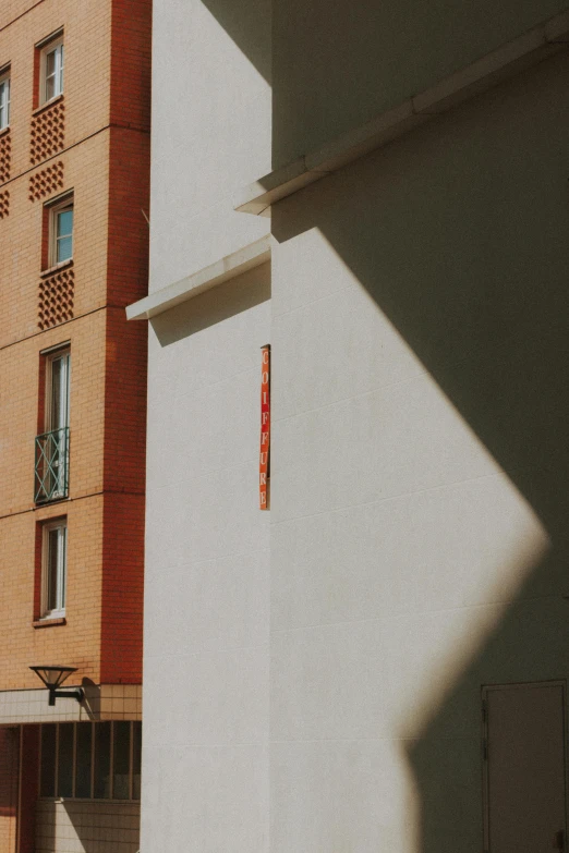 the shadows are cast from the back and front of a building