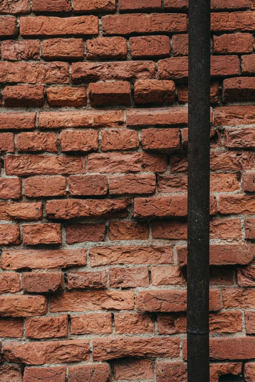 the brick wall is made of red bricks