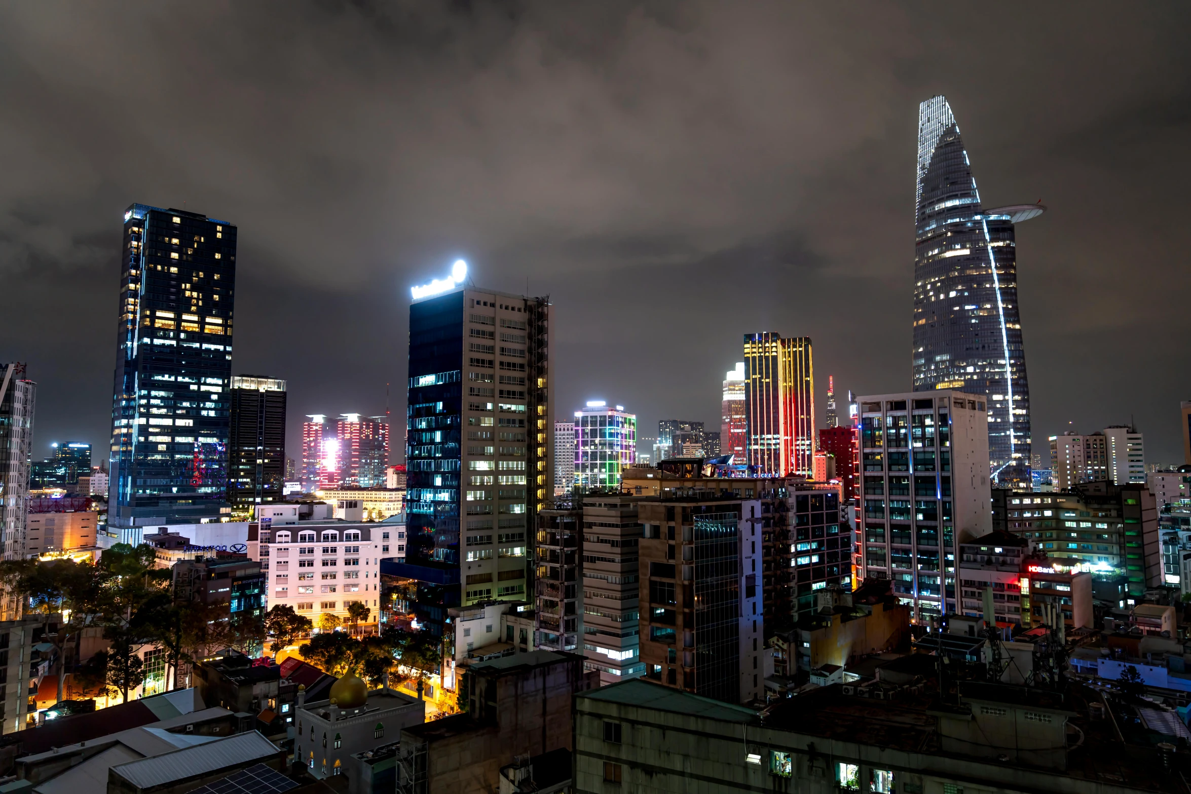 a very long exposure of a city in the dark