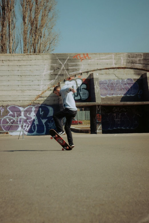 a young man doing a trick on a skateboard