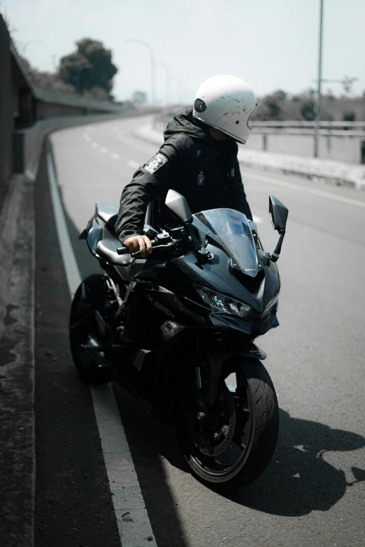 person riding on motorcycle on the highway