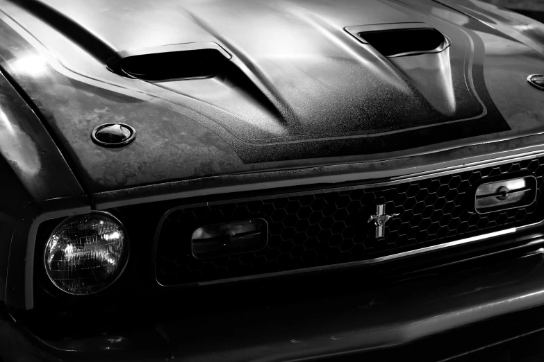 an image of a car with a hood painted black