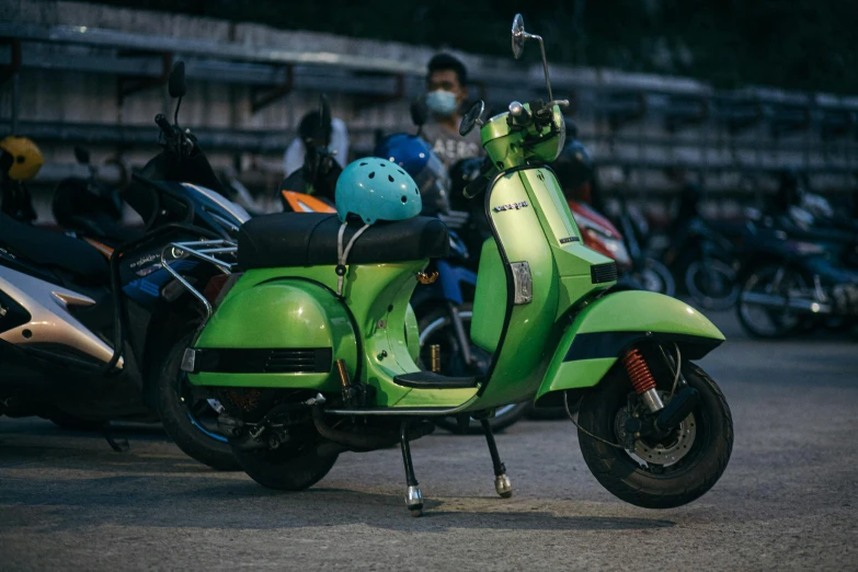 a green motor bike on display at a motorcycle rally