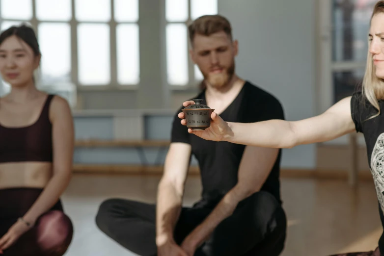 several people are doing a yoga exercise on the floor