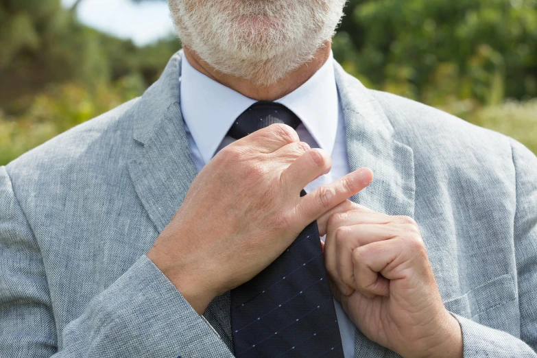 a man is wearing a suit and tie